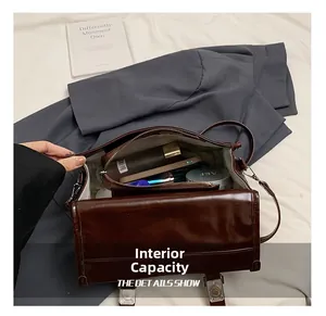 Detail view of deep brown leather bag interior showing spacious compartments and storage