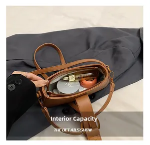 Detail of leopard bucket bag interior showing capacity for perfume and lipstick