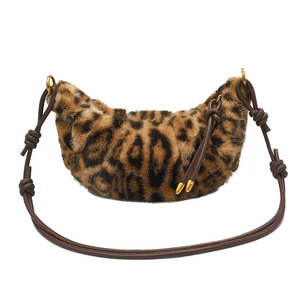 Leopard print faux fur crescent bag with brown knotted leather strap and gold hardware