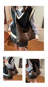 Three-view detail of deep brown glossy PU leather hobo bag with gold logo on wood backdrop
