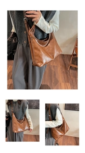 Detailed macro view of dark brown hobo bag with luxury logo and matte leather texture