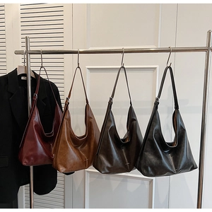 Detailed comparison of four large capacity leather hobo bags in burgundy and black tones