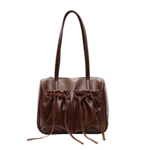 Vintage dark brown pleated shoulder bag with bow drawstrings and two front pockets