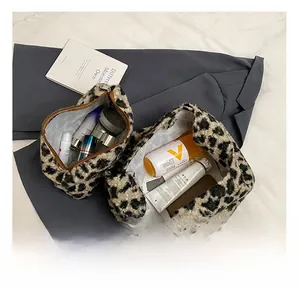 Interior storage capacity of leopard print plush bags with cosmetics and skincare items