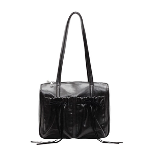 Minimalist black pleated tote bag with bow details and shoulder straps for women
