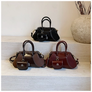 Minimalist matte vintage Boston bags in black, coffee, and burgundy with mini coin purses