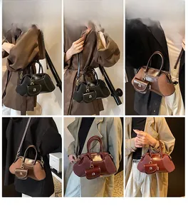 Detailed views of a vintage Boston bag with adjustable strap and mini decorative pouch