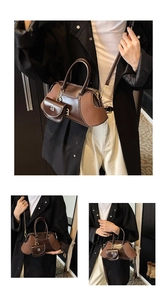 Detail of retro color-block Boston bag with small round coin purse charm and strap