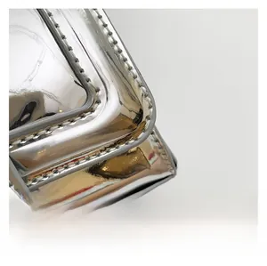 Detail of silver mirror finish PU leather surface with premium white stitching