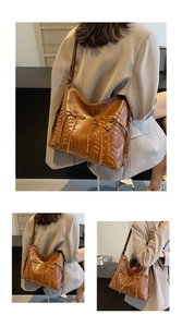 Dettaglio borsa tote vintage marrone con coulisse intrecciate e rivetti in metallo argento