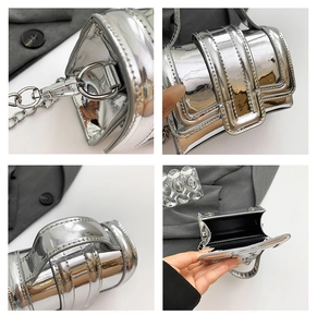 Detail view of mini silver mirror bag showing metallic chain, stitching, and black lining