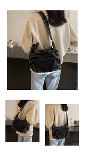 Detailed close-up of a black washed canvas crossbody bag with multiple utility pockets