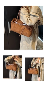 Detailed view of large brown suede tote bag with leather straps and decorative buckle