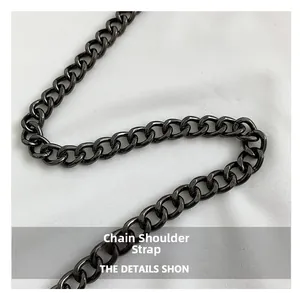 Macro shot of gun-black metal chain strap with polished oval links for a gothic bag