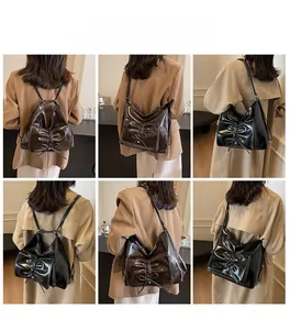 Vielseitige Ansichten einer Falten-Handtasche mit Schleife als Schulter- und Rucksack