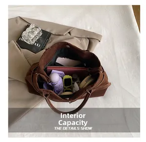 Interior view of brown suede tote bag showing large capacity for umbrella and notebook