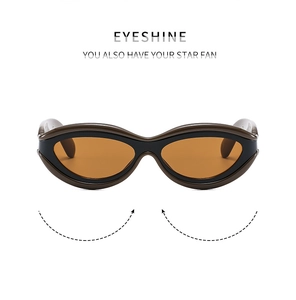 Détail de lunettes de soleil œil-de-chat rétro avec monture noire et verres orange