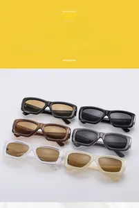 Detailed macro view of trendy square sunglasses in multiple frames like black and cream