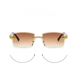 Detail of luxury rimless sunglasses with gradient lenses and golden leopard head decoration