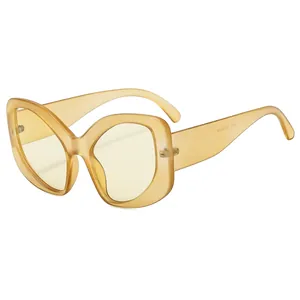 Elegant cat-eye sunglasses with translucent amber frames and pale yellow lenses