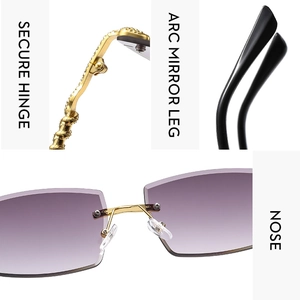 Detail of rimless sunglasses with purple gradient lenses and gold snake-textured temples