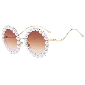 Luxury round sunglasses with pearl-embellished gold frame and gradient brown lenses