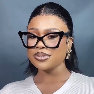Chic cat-eye anti-blue light glasses with black irregular frames worn by a female model