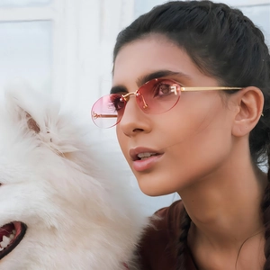 Vintage oval rimless sunglasses for women with pink gradient lenses and gold metal frames