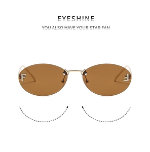 Detail of rimless oval sunglasses featuring brown gradient lenses and F rhinestone logo