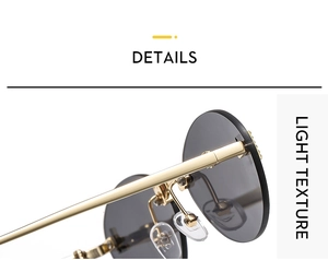 Close-up of rimless oval sunglasses with gold metal temples and light texture detail