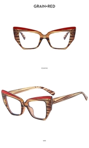 Detail view of cat eye glasses with wood grain finish and red transparent accents