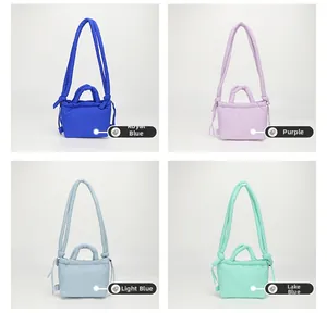 Detailed view of quilted nylon mini bags in royal blue, purple, light blue, and lake blue