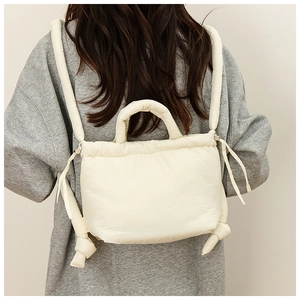 Chic quilted nylon backpack in cream white featuring puffy cloud texture for autumn