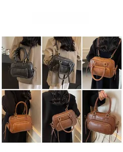 Detailed views of vintage faux leather Boston bag showing crossbody and shoulder wear