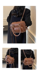 Macro shot of vintage brown PU leather bag with versatile shoulder straps and metal hardware