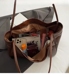 Top view of spacious interior storage for large dark brown matte leather tote bag