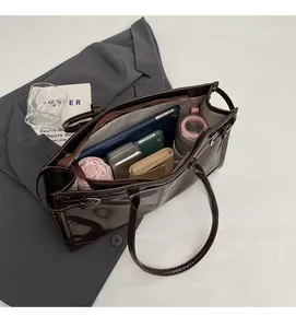Interior view of deep brown leather tote bag showing large capacity for daily essentials