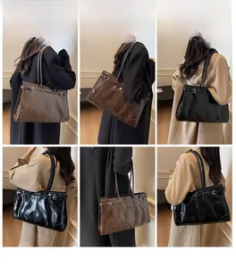 Multiple views of large vintage faux leather tote bag with glossy finish and buckle detail