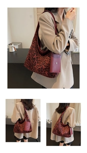 Detail shot of a large leopard print tote bag with a matching small pouch on a model