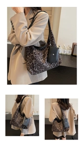 Detail of vintage leopard print tote bag with black detachable mini charm pouch