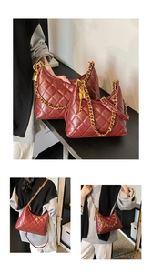 Detail of red quilted moon bags in two sizes with gold chain straps and metal charms