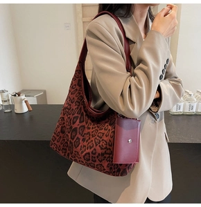Macro shot of stylish leopard print tote bag with a matching small coin purse attachment