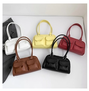 Flat lay of vintage PU leather shoulder bags in white, yellow, red, brown, and black
