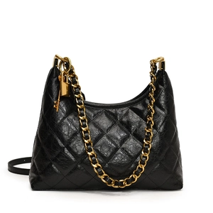 Quilted black leather hobo bag with chunky gold chain strap and padlock detail
