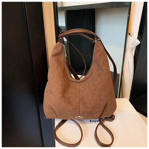 Classic brown suede Hobo bag with leather straps and metal detail for versatile carrying