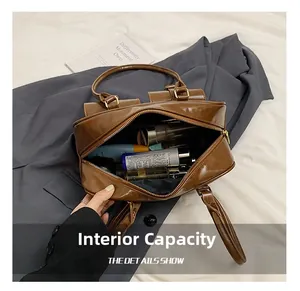 Detail showing internal storage capacity of the brown Boston bag with skincare products