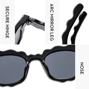 Detail view of scalloped edge sunglasses showing secure hinges and arc mirror legs