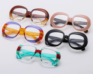 Close-up of retro oval sunglasses frames in various stylish colors and polished finishes