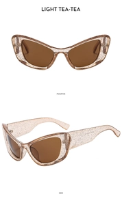 Detailed views of vintage cat eye sunglasses with glitter tea frames and brown lenses