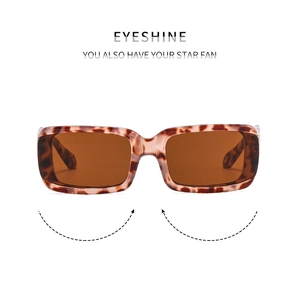 Close-up of stylish rectangular tortoise shell frame sunglasses with dark brown lenses